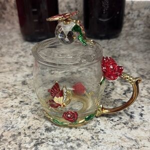 Elegant Glass Mug with Red and Gold Accents